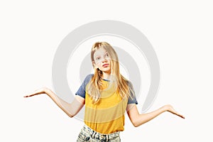 Young beautiful teenager model girl posing over white isolated background showing emotional facial expressions.