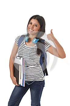 Young beautiful and trendy latin student girl carrying backpack smiling happy and confident