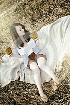 young beautiful unusual girl illustrates conceptual idea in field