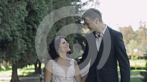 Young and beautiful wedding couple together. Lovely groom and bride. Wedding day. Slow motion