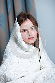 Young beautiful white woman awaking in light room.