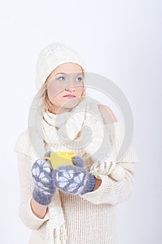 Young beautiful winter girl with cup of tea