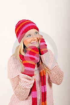 Young beautiful winter girl with pink gloves