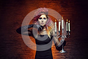 Young and beautiful witch making witchcraft