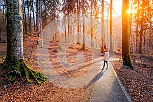 Young beautiful woamn in nature walkway at Neuschwanstein Castle in Fussen,Germany