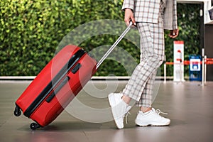 Young beautiful woman in Airport entrance hall.