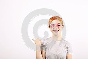 Young beautiful woman, attractive natural redhead, showing emotions, facial expressions, posing on isolated background.