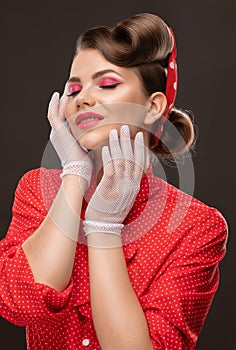 Young beautiful woman with a beautiful hairstyle and bright makeup. Professional makeup and facial care