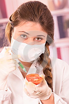 Young beautiful woman biologist experimenting with