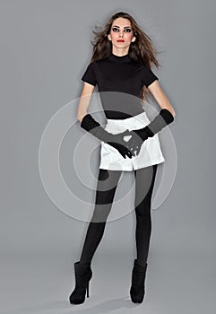 Young beautiful woman in black combi dress photo