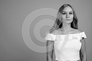 Young beautiful woman with blond hair in black and white