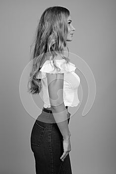 Young beautiful woman with blond hair in black and white