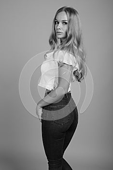 Young beautiful woman with blond hair in black and white