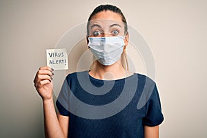 Young beautiful woman with blue eyes wearing medical mask