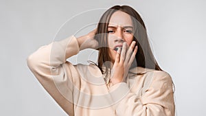 Young beautiful woman bored yawning tired covering mouth with hand. Restless and sleepiness