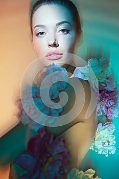 Young beautiful woman with bouquet of roses. Professional art makeup