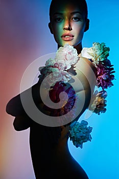 Young beautiful woman with bouquet of roses. Professional art makeup