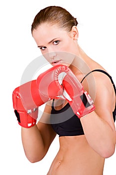 Young beautiful woman in boxing gloves