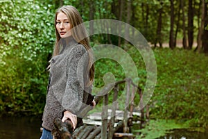 Young beautiful woman on the brige