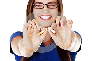 Young beautiful woman with broken cigarette.