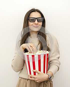 a young beautiful woman brunette with a popcorn