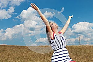 Young beautiful woman celebrating freedom