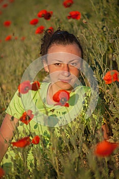 Young beautiful woman on cereal field in summer