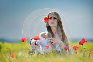 Young beautiful woman on cereal field in summer