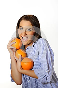 Young beautiful woman with citrus orange fruit