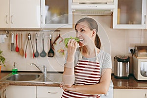 Young beautiful woman is cooking in the kitchen.