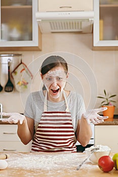 Young beautiful woman is cooking in the kitchen.