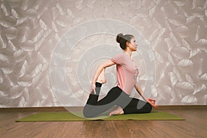 Woman practising yoga,home workout concept