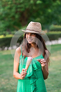 Young beautiful woman eating an ice cream