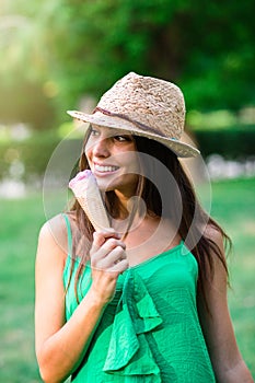 Young beautiful woman eating an ice cream