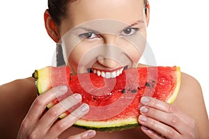 Young beautiful woman is eating watermelon.