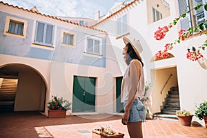 Young beautiful woman enjoy cozy Italy courtyard in Sardinia isl