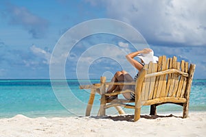 Young beautiful woman enjoying summer vacation, beach relax, sum