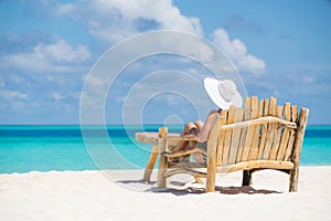Young beautiful woman enjoying summer vacation, beach relax, sum