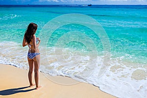 Young beautiful woman enjoying at the tropical ocean. Gorgeous g