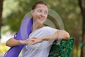 Young beautiful woman exercising at the park outdoors