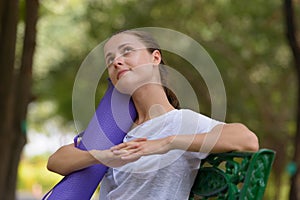 Young beautiful woman exercising at the park outdoors