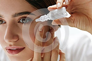 Young Beautiful Woman With Eyedrops. Vision And Medicine Concept