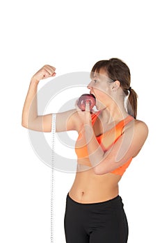 Young beautiful woman after fitness time and exercising with red apple