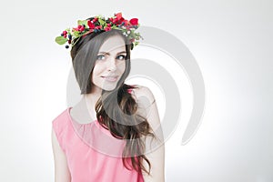 Young beautiful woman with flower wreath on head