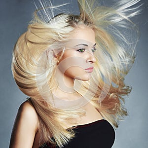 Young beautiful woman. Flying hair Blond girl