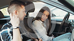 Young Beautiful Woman Getting a Driving Lesson In The Car, Fasten Seat Belts