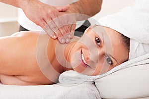 Young beautiful woman getting spa treatment