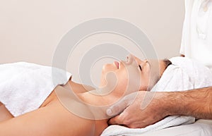 Young beautiful woman getting spa treatment