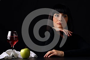 Young beautiful woman with a glass of wine