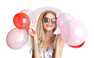 Young beautiful woman with glasses holding red pink balloons, va